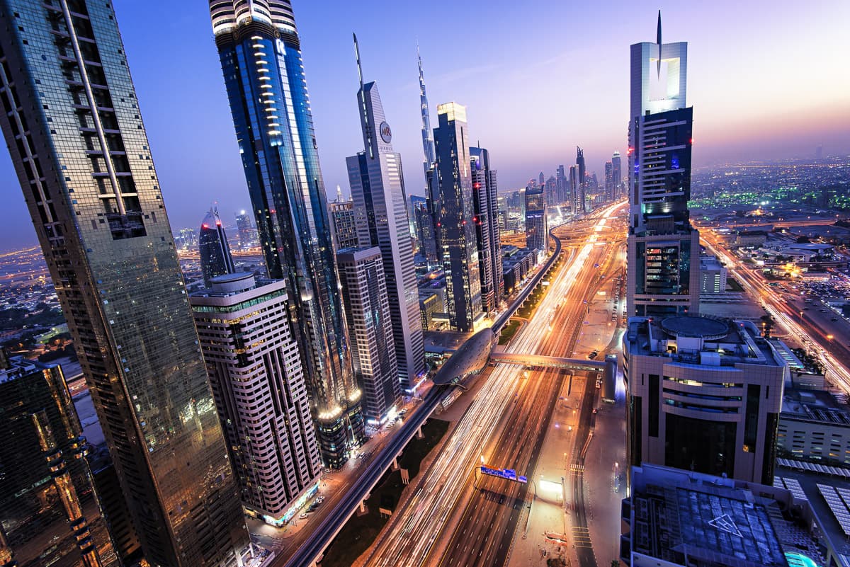 The Downtown Dubai skyline illuminated at night, venue district for the AI in Dubai teacher training.