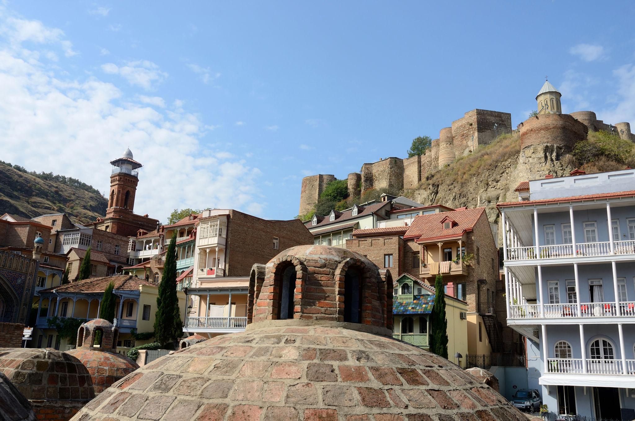 Tbilisi Old Town — domed sulfur baths, Narikala fortress, and traditional balconied houses